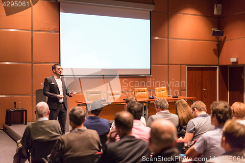 Image of Business speaker giving a talk at business conference event.