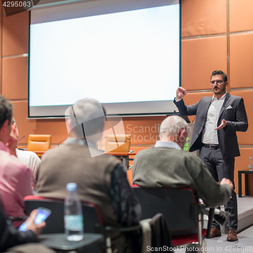 Image of Business speaker giving a talk at business conference event.