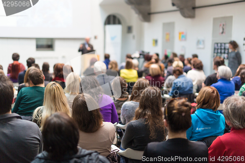 Image of Man giving presentation in lecture hall at university.