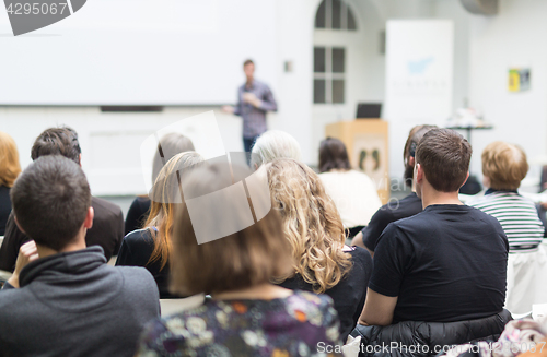 Image of Man giving presentation in lecture hall at university.