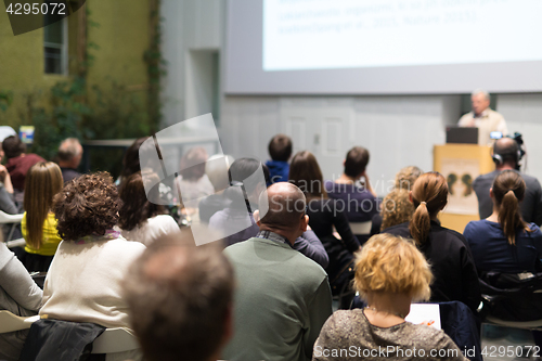 Image of Man giving presentation in lecture hall at university.