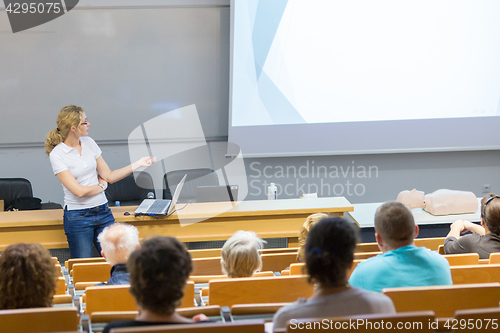 Image of Instructor teaching first aid cardiopulmonary resuscitation workshop.