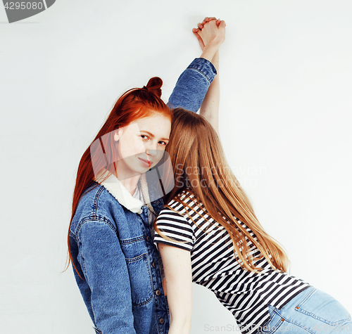 Image of best friends teenage girls together having fun, posing emotional on white background, besties happy smiling, lifestyle people concept close up. making selfie