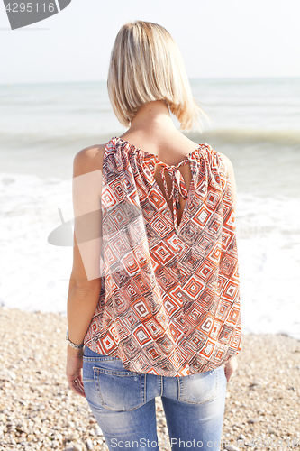 Image of Young woman on beach