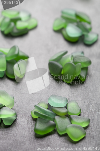 Image of green pieces of glass polished by the sea