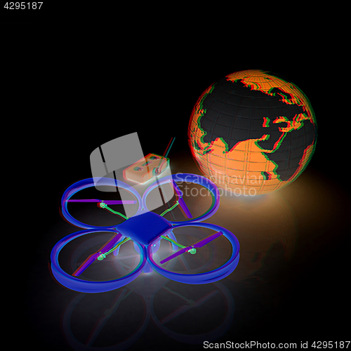 Image of Quadrocopter Drone with Earth Globe and remote controller on a w