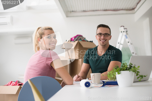 Image of Young couple moving in a new home