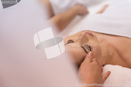 Image of woman receiving a head massage