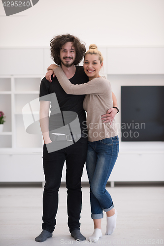 Image of couple hugging in their new home