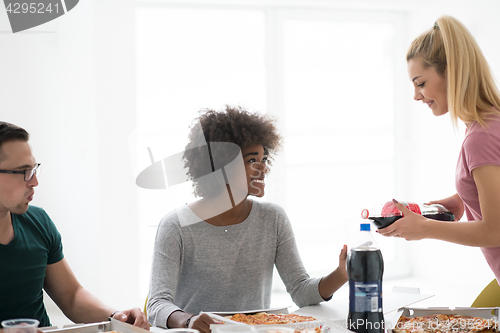 Image of multiethnic group of young people have a lunch break