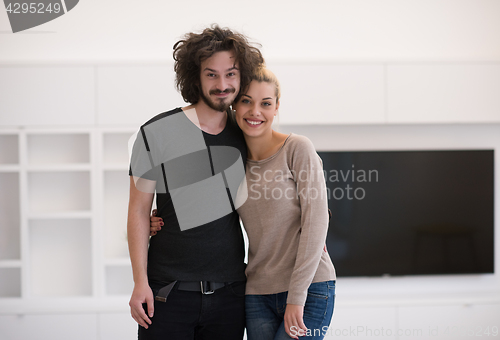 Image of couple hugging in their new home