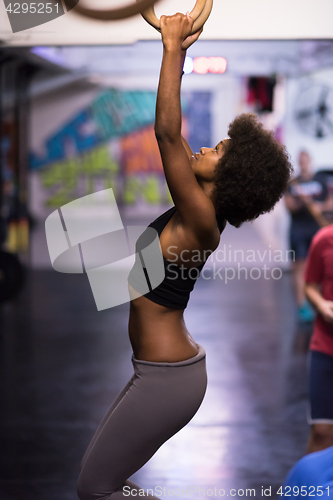 Image of black woman doing dipping exercise