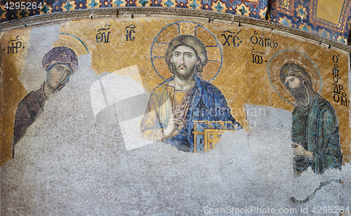 Image of 13th century Deesis Mosaic of Jesus Christ flanked by the Virgin Mary and John the Baptist in the Hagia Sophia temple in Istanbul, Turkey.