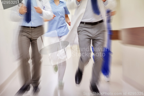 Image of close up of medics or doctors running at hospital