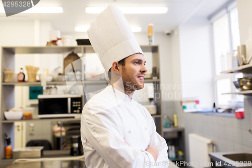 Image of happy male chef cook at restaurant kitchen