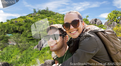 Image of happy couple with backpacks traveling