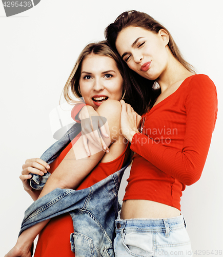 Image of best friends teenage girls together having fun, posing emotional on white background, besties happy smiling, lifestyle people concept close up