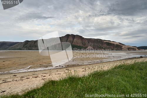 Image of Sandy coast with mountain in Tanamunningen Nature Reserve in Norther Norway