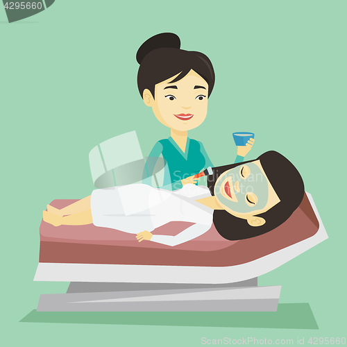 Image of Woman in beauty salon during cosmetology procedure