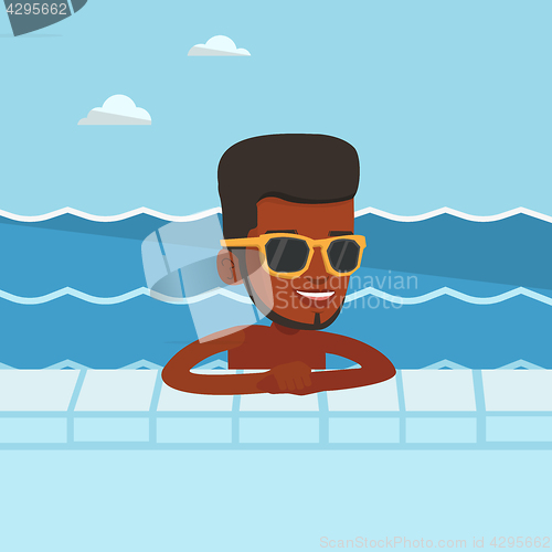 Image of Smiling young man in swimming pool.