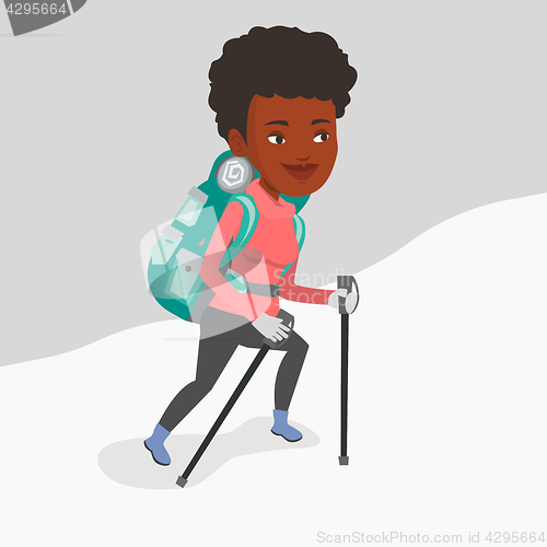 Image of Young mountaneer climbing a snowy ridge.