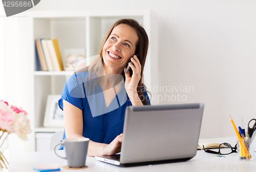 Image of woman calling on smartphone at office or home