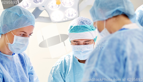 Image of group of surgeons in operating room at hospital