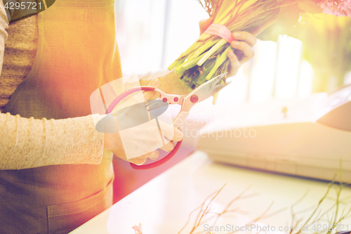 Image of close up of florist making bunch at flower shop