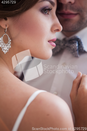 Image of Beautiful bride in wedding dress, white background