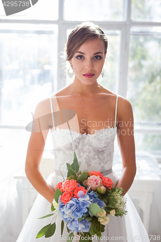 Image of Beautiful bride in wedding dress, white background