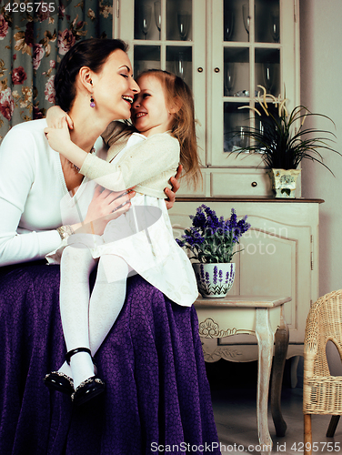 Image of young mother with daughter at luxury home interior vintage