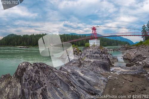 Image of suspension bridge on mountain river