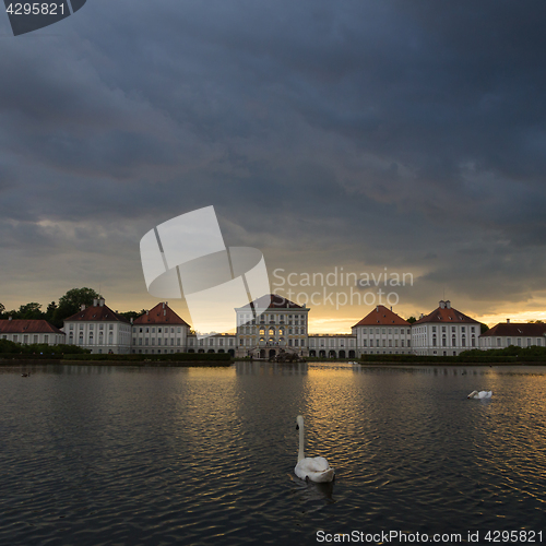 Image of Dramatic scenery of post storm sunset of Nymphenburg palace in Munich Germany.