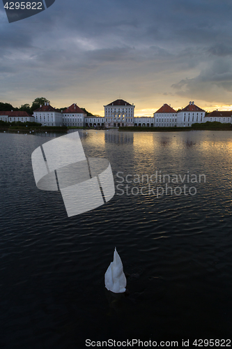 Image of Dramatic scenery of post storm sunset of Nymphenburg palace in Munich Germany.