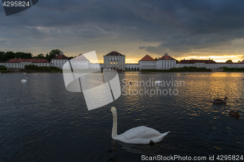 Image of Dramatic scenery of post storm sunset of Nymphenburg palace in Munich Germany.