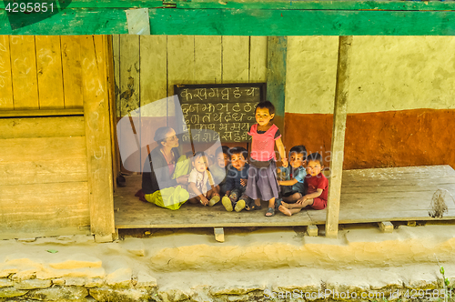 Image of Teacher with children in Nepal