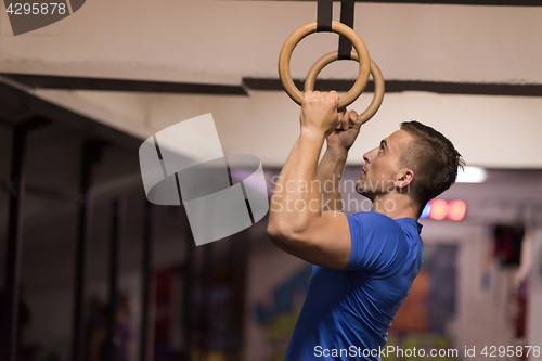 Image of man doing dipping exercise