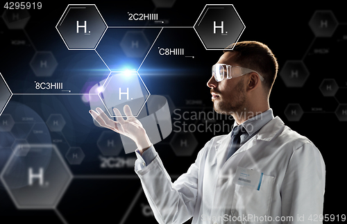 Image of scientist in lab goggles chemical formula