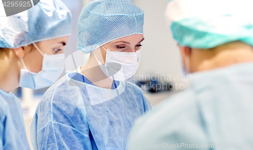 Image of group of surgeons in operating room at hospital