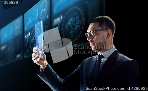 Image of businessman with tablet pc and virtual screens