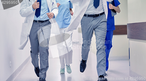 Image of close up of medics or doctors running at hospital