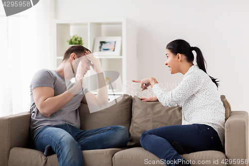 Image of unhappy couple having argument at home