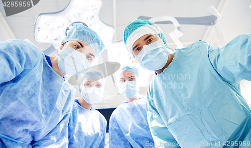 Image of group of surgeons in operating room at hospital