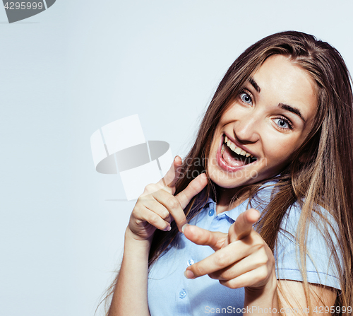 Image of young pretty blond teenage girl emotional posing, happy smiling isolated on white background, lifestyle people concept