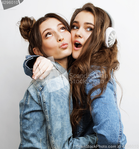 Image of best friends teenage girls together having fun, posing emotional on white background, besties happy smiling, lifestyle people concept close up