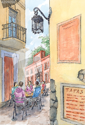 Image of Spanish old street with seated persons