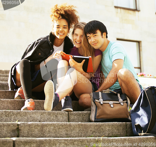 Image of cute group teenages at the building of university