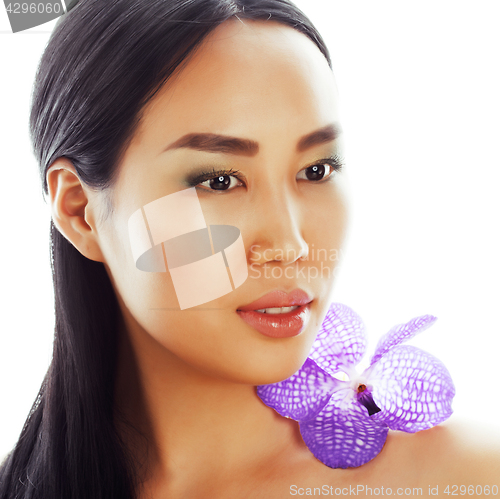 Image of young pretty asian woman with flower purple orchid closeup isola