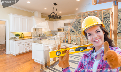 Image of Female Construction Worker In Front of House Framing Gradating t