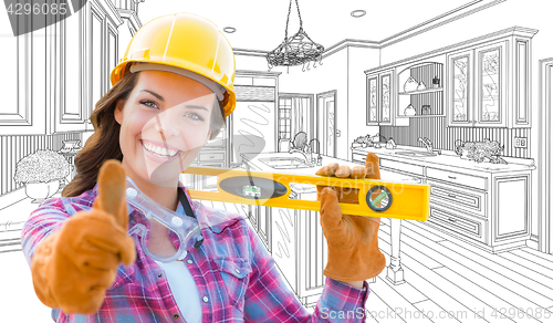 Image of Female Construction Worker With Thumbs Up Holding Level In Front